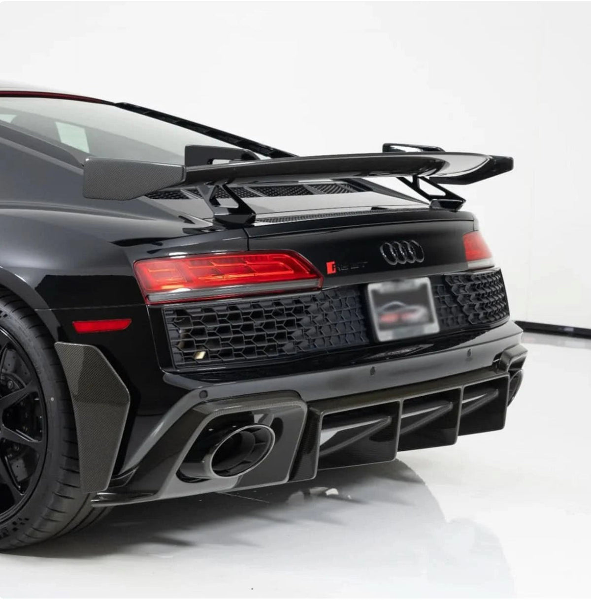 Black Audi R8 4S Facelift, rear three-quarter view, with fitted carbon rear diffuser and wing (Performance Style)