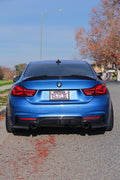 Blue BMW F32 coupé rear view with fitted carbon rear diffuser (MP Style)