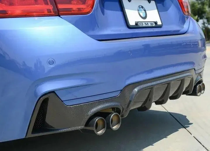Blue BMW F32 rear three-quarter close-up with carbon diffuser and two exhaust tips (MP Style)