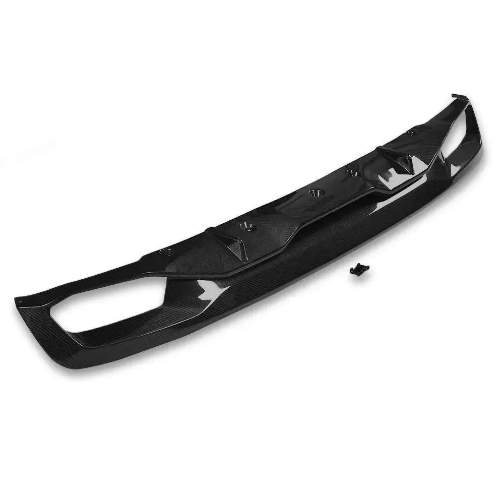 Quad-outlet carbon fiber rear diffuser, three-quarter view, with mounting clip (M5 Style) – BMW G30 5 Series