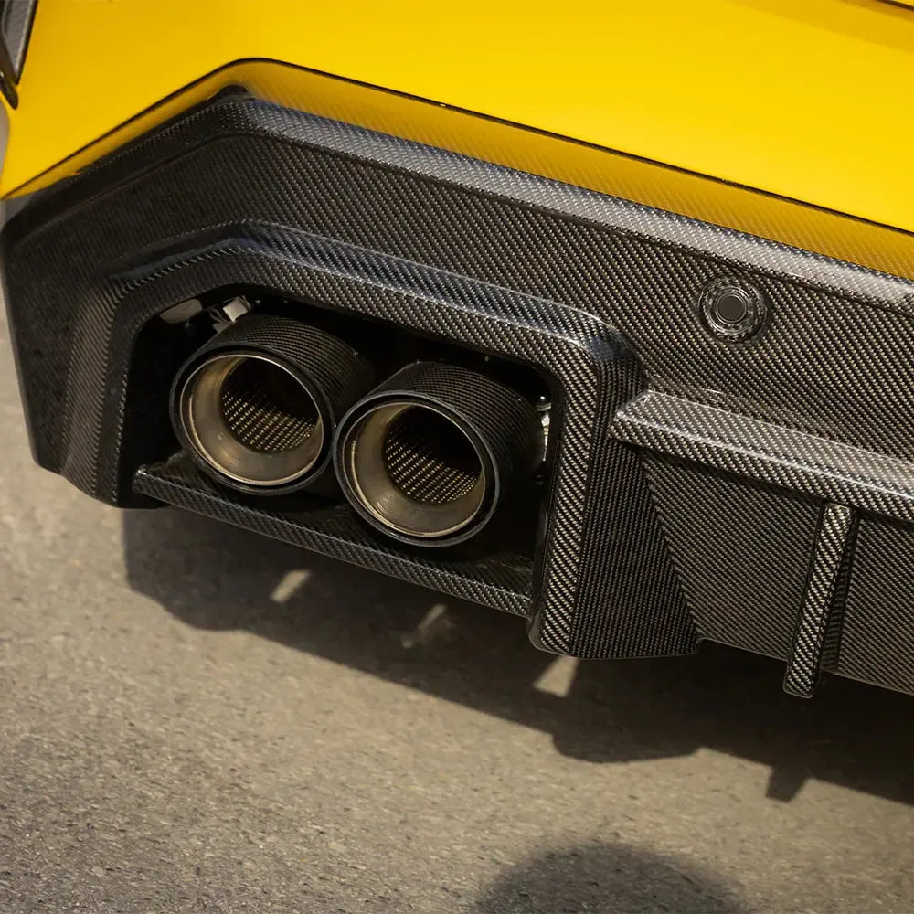 Carbon exhaust tip cover for the factory tips, yellow BMW G90 M5 rear close-up