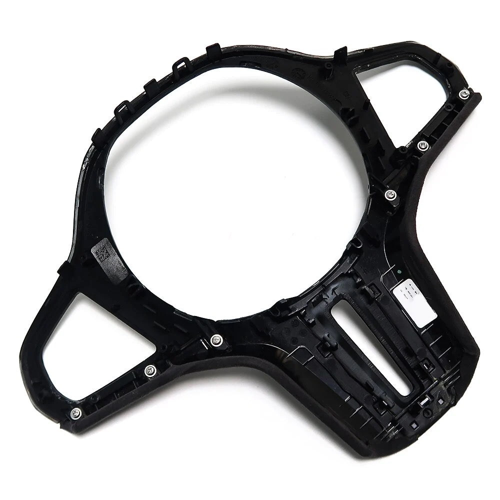 Back of the steering wheel trim with mounting clips, on a white background – BMW F90 M5 and G30 5 Series
