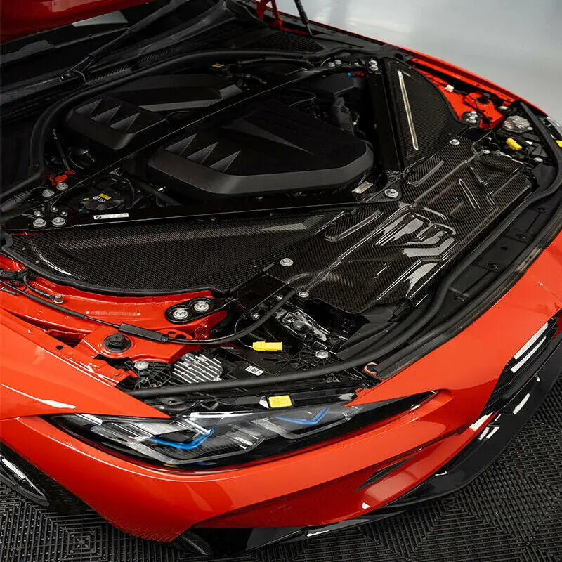 Motortér burkolat carbon fiber bmw g80 g81 m3 g82 g83 m4 g87 m2 fekete fényes kipufogó rendszer kialakítással