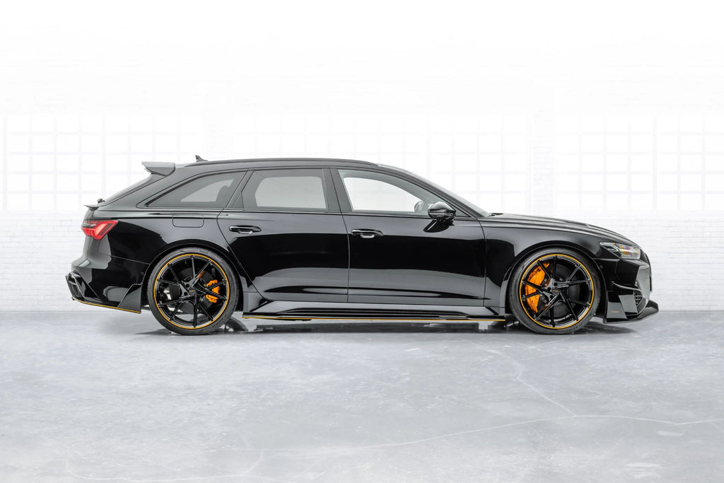 Black Audi RS6 Avant C8, rear three-quarter side view, with clearly visible lower skirt plate (MSY Style)