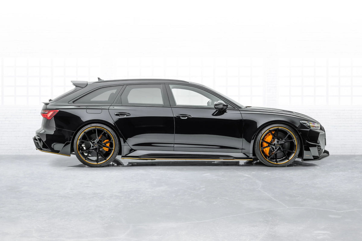 Black Audi RS6 Avant C8, rear three-quarter side view, with clearly visible lower skirt plate (MSY Style)