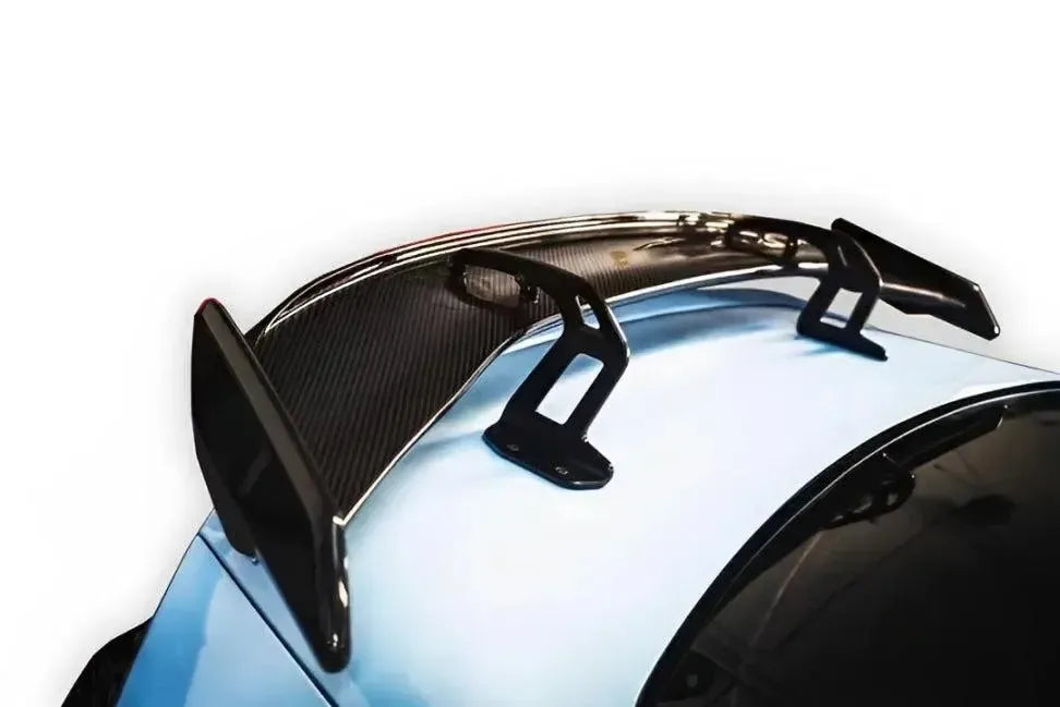 Carbon fiber rear wing on a light blue BMW G87 M2 (AK Style)