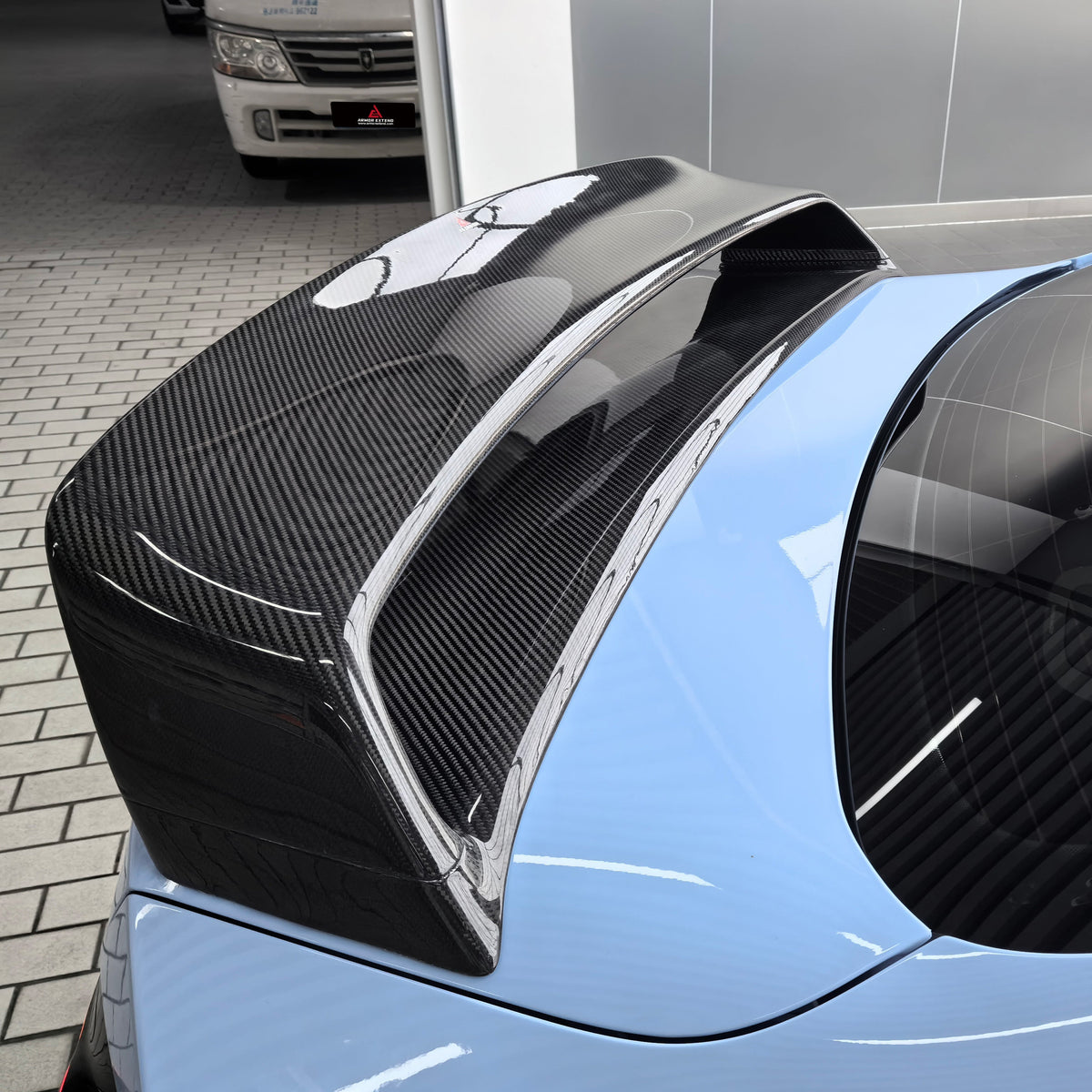 Light blue BMW G87 M2 double-layer carbon fiber spoiler close-up (Double Layer spoiler)