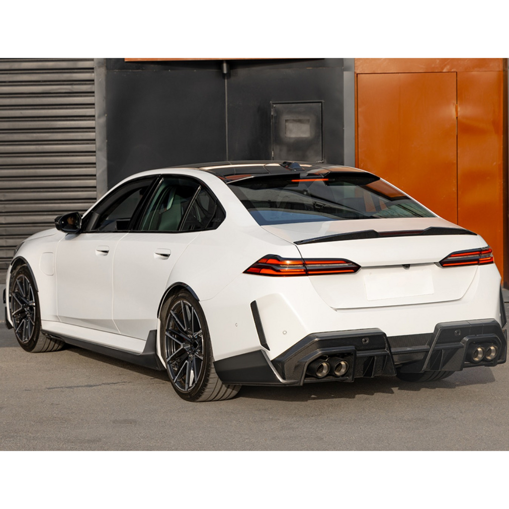 Carbon fiber roof spoiler (SQ Style) on a white BMW G90 M5 sedan, rear three-quarter view